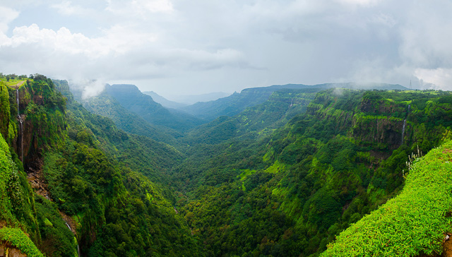 small waterfalls amidst clouds in amboli hill maharashtra india