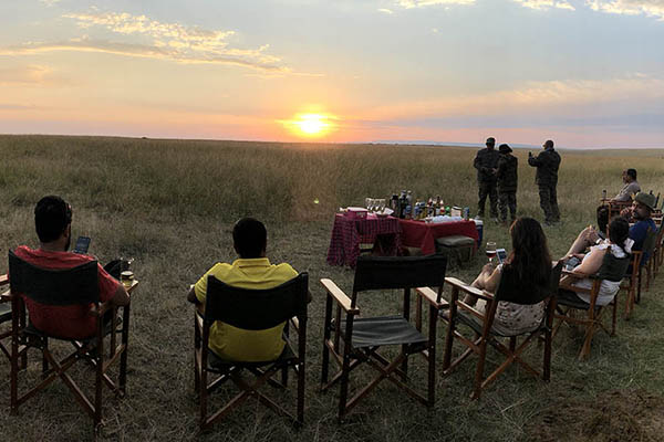 Sundowners on Safari: Enjoy your favourite drink with the savannah sunset, the golden hour in the African savannah