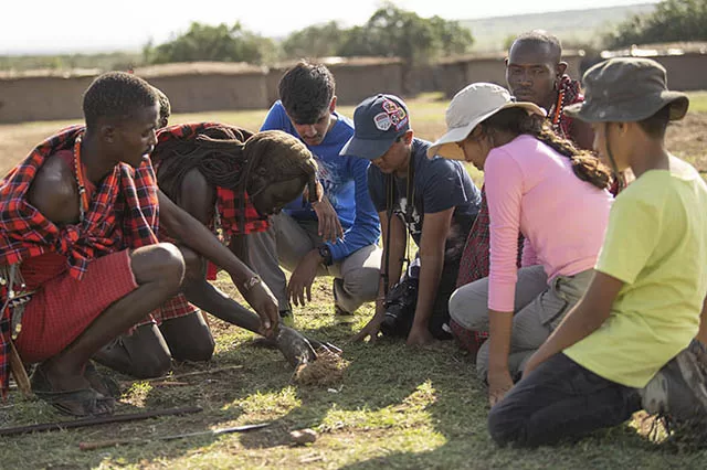 Kids interacting with Maasai villagers