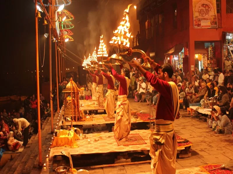 Priests performing Ganga maha aarti near the bank of the river