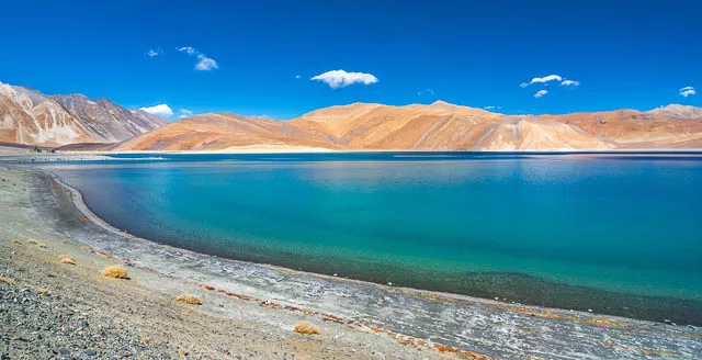 clear blue sky above pangong lake in leh ladakh