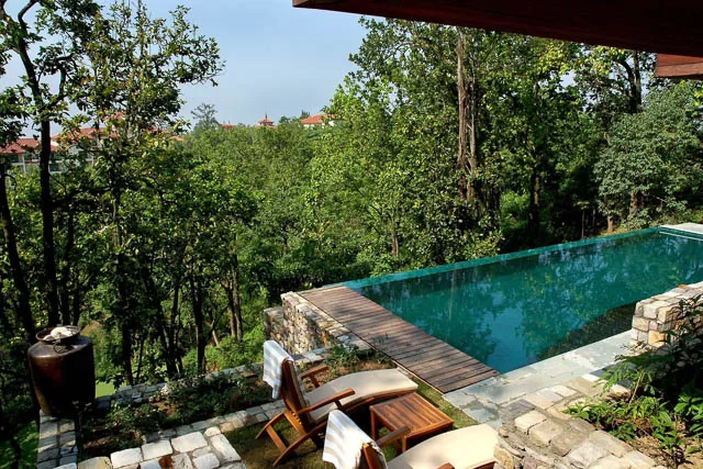 swimming pool by villa in ananda luxury spa in the himalayas, uttarakhand