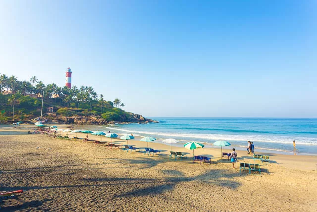 beach chairs in view of ocean waves at kovalam light house beach, kerala