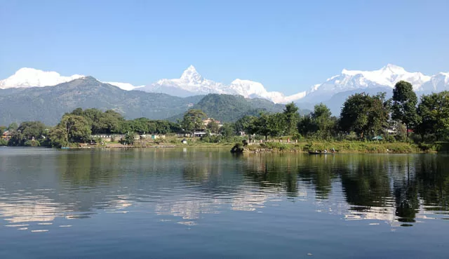 himalayas can be seen from phewa lake in pokhara, nepal