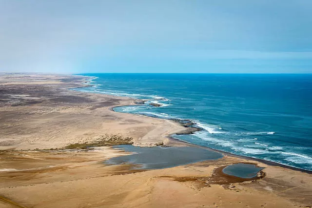 hostile skeleton coast where atlantic ocean meets namibia