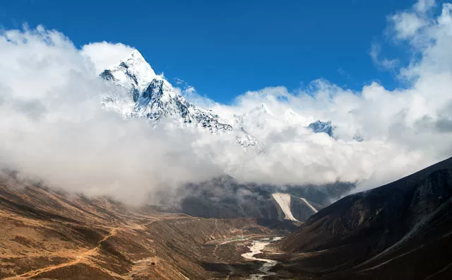 mount ama dablam within clouds, a way to everest base camp, khumbu valley, nepal