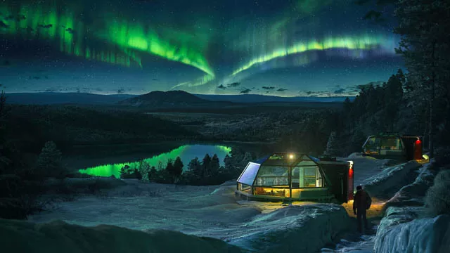 polar lights above glass igloo in kakslauttanen arctic resort, finland