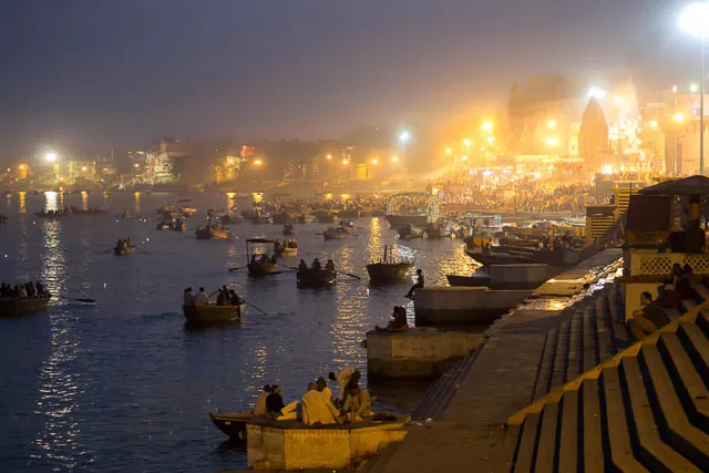 view of the ghats and the ganges river at night in varanasi, uttar pradesh