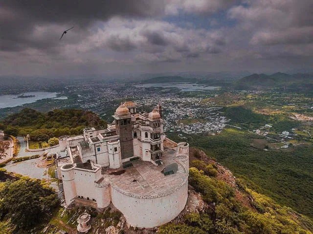 aerial view of dark clouds over monsoon palace in udaipur, rajasthan
