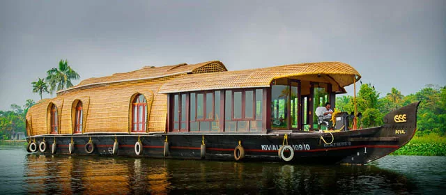 a beautiful houseboat on the backwaters of alleppey, kerala