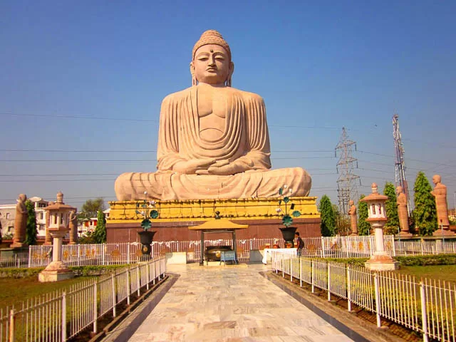 a path leading to the giant buddha statue near mahabodhi temple in bodh gaya, bihar