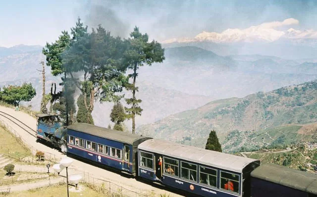 smoke arises from darjeeling toy train, west bengal