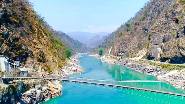 laxman jhula bridge over ganges river in rishikesh, uttarakhand