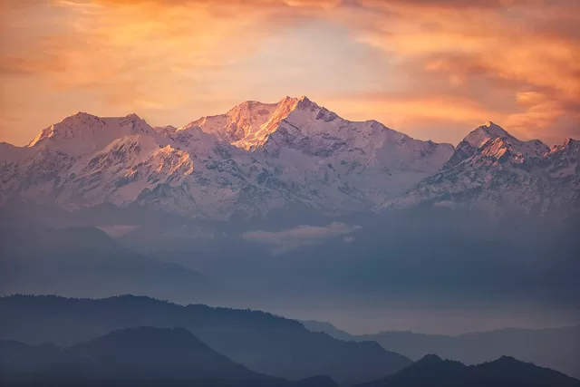 shadow of golden sunrise falls on the himalayas in darjeeling west bengal india