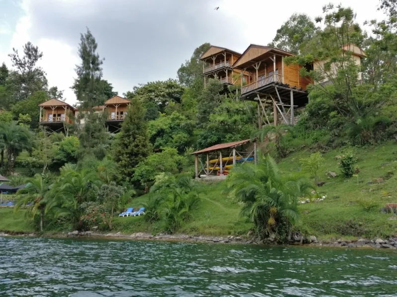 A boat drifting toward an island on Lake Kivu.