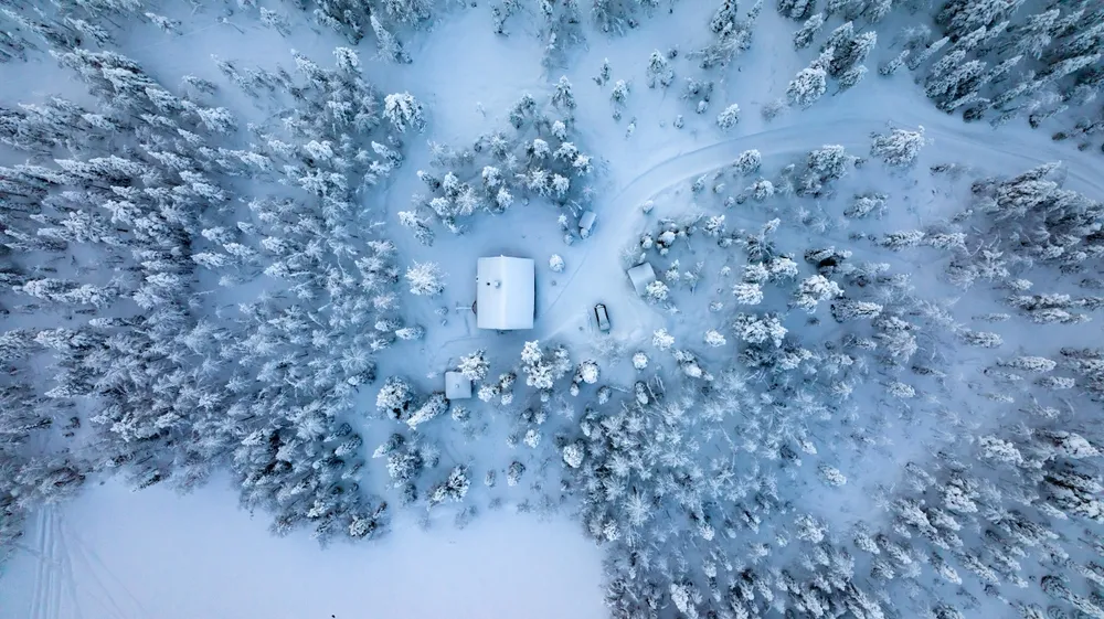 Glass igloos under the aurora at Levi.