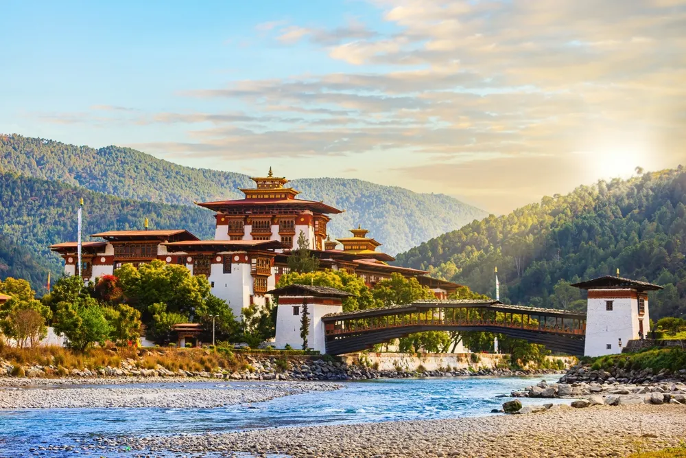 Punakha Dzong glowing at the confluence of the Pho and Mo Chhu.
