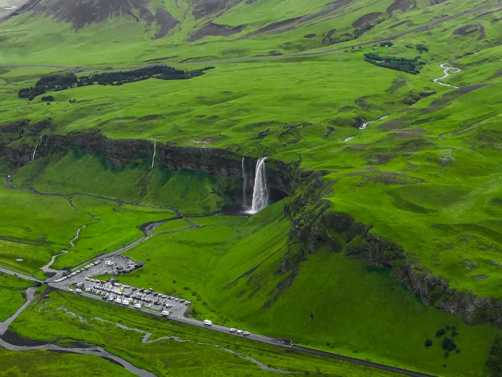 South Coast — waterfalls & black sand.