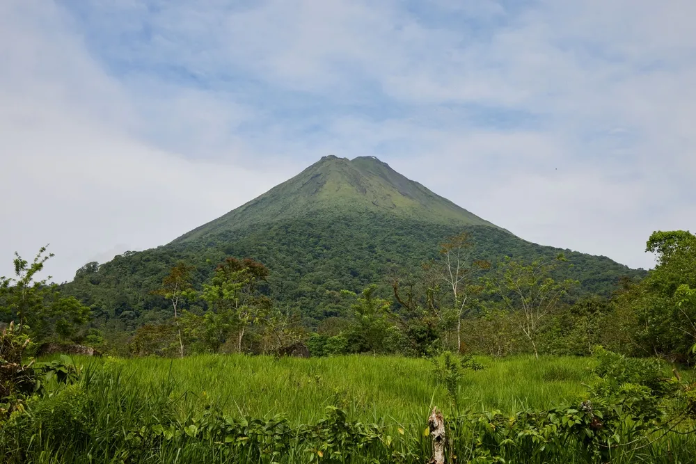 The Arenal volcano above the rainforest.