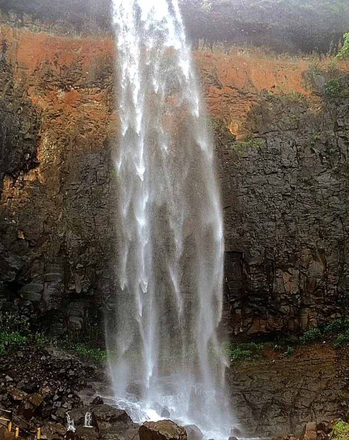 Monsoon waterfalls tumbling through green Konkan hills.