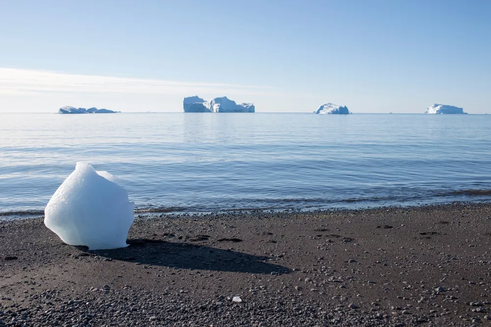 Disko Bay — island & icebergs.