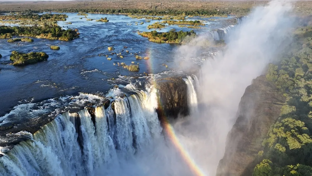 The Zambezi in full flood, spray rising over the gorge.